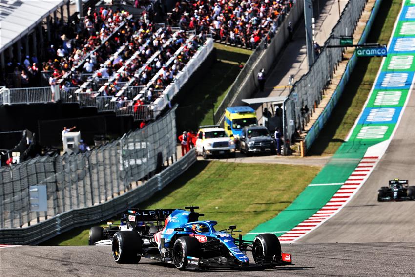 F1 cars driving up the hill in Texas